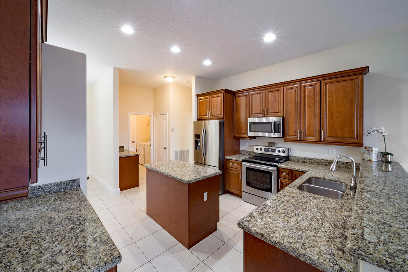 Kitchen with wood cabinetry and granite countertops