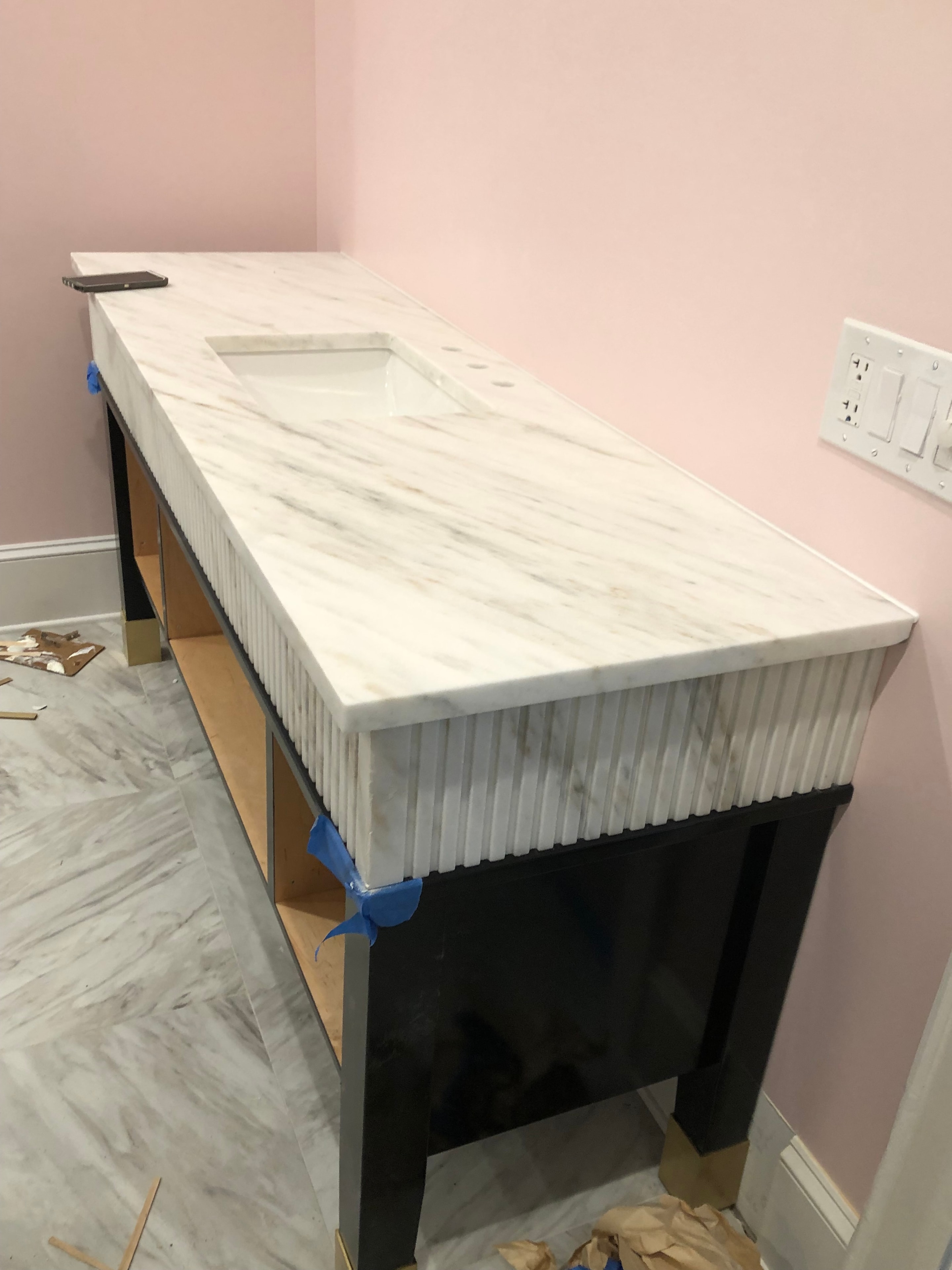 White cabinetry installation in progress