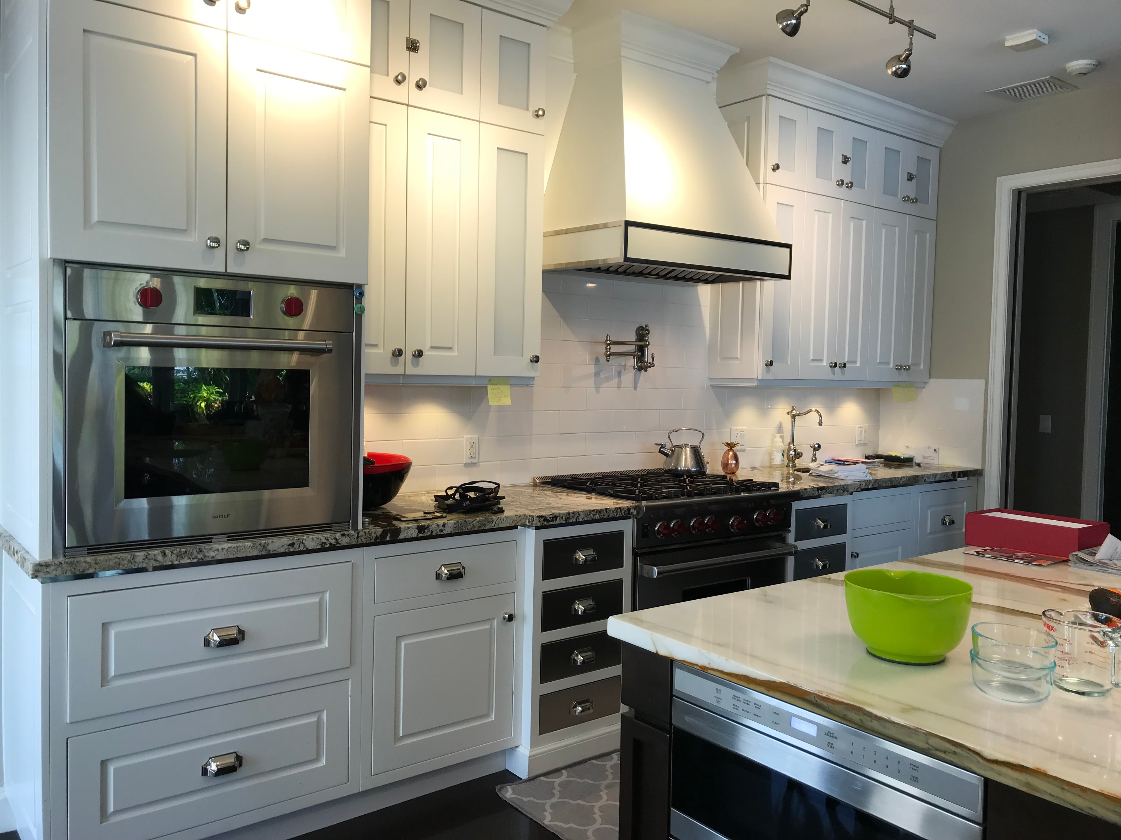 White kitchen with custom cabinetry and granite countertops