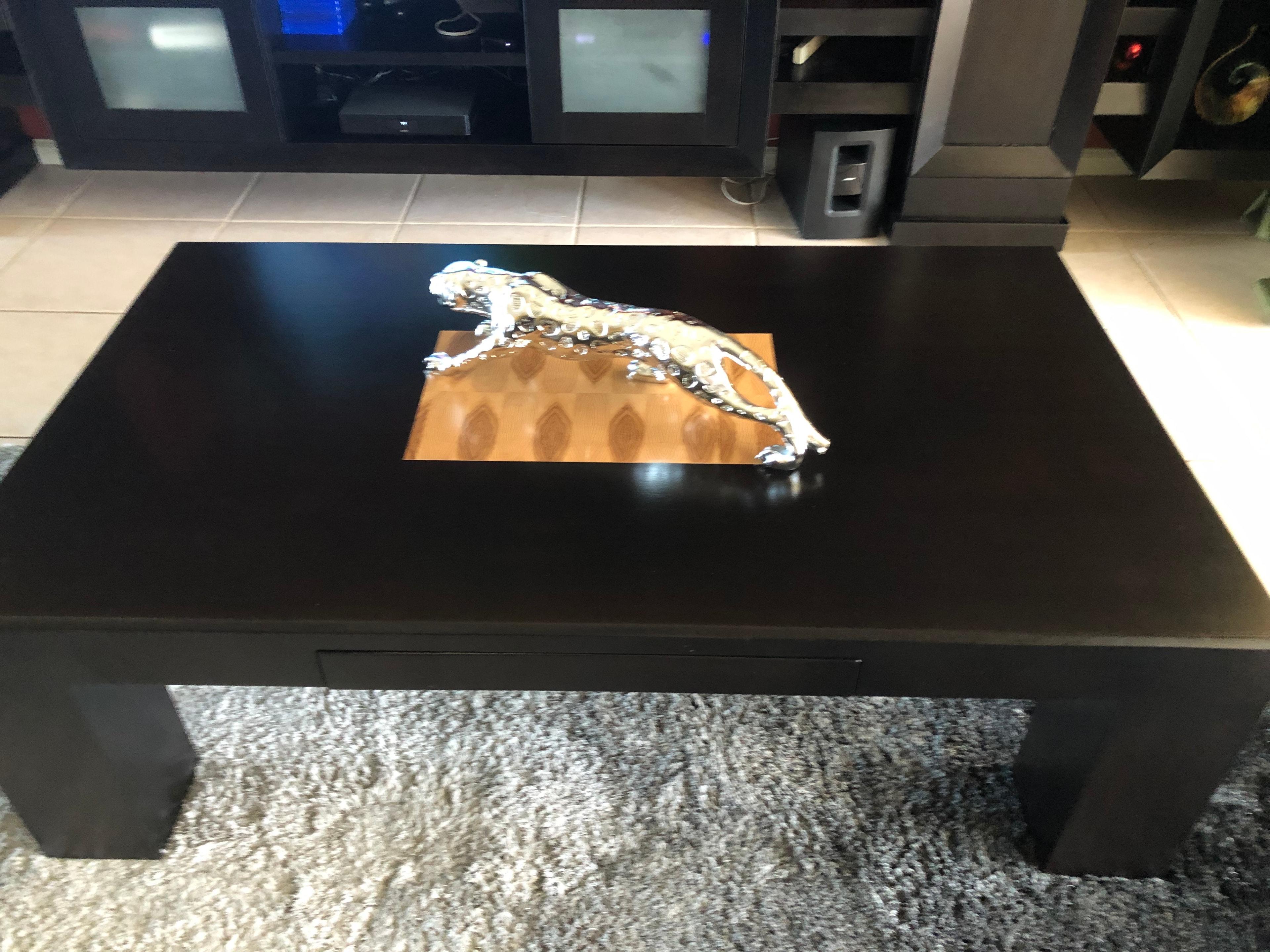 Custom dark coffee table with inlaid wood panel